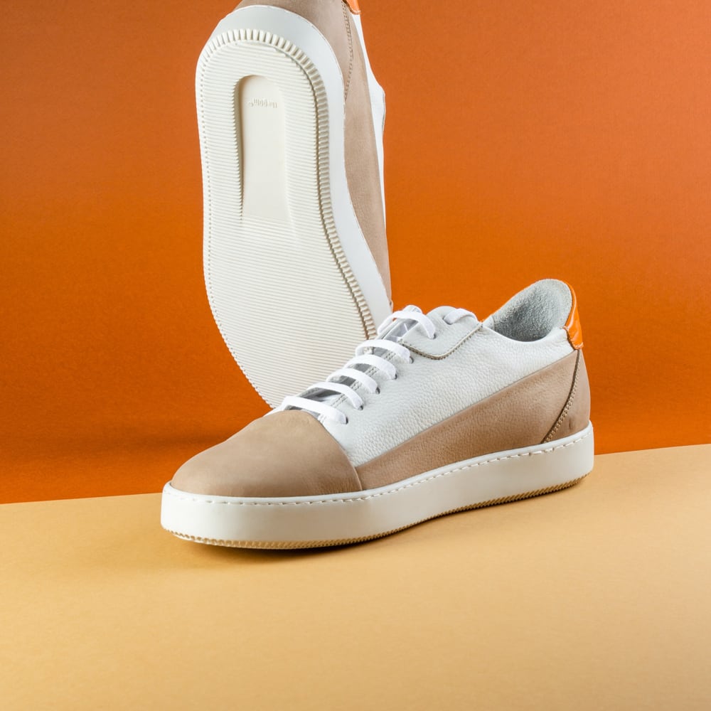 tennis shoes with beige and white tones