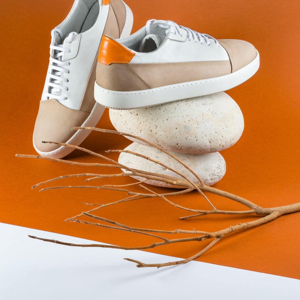 tennis shoes with beige and white tones